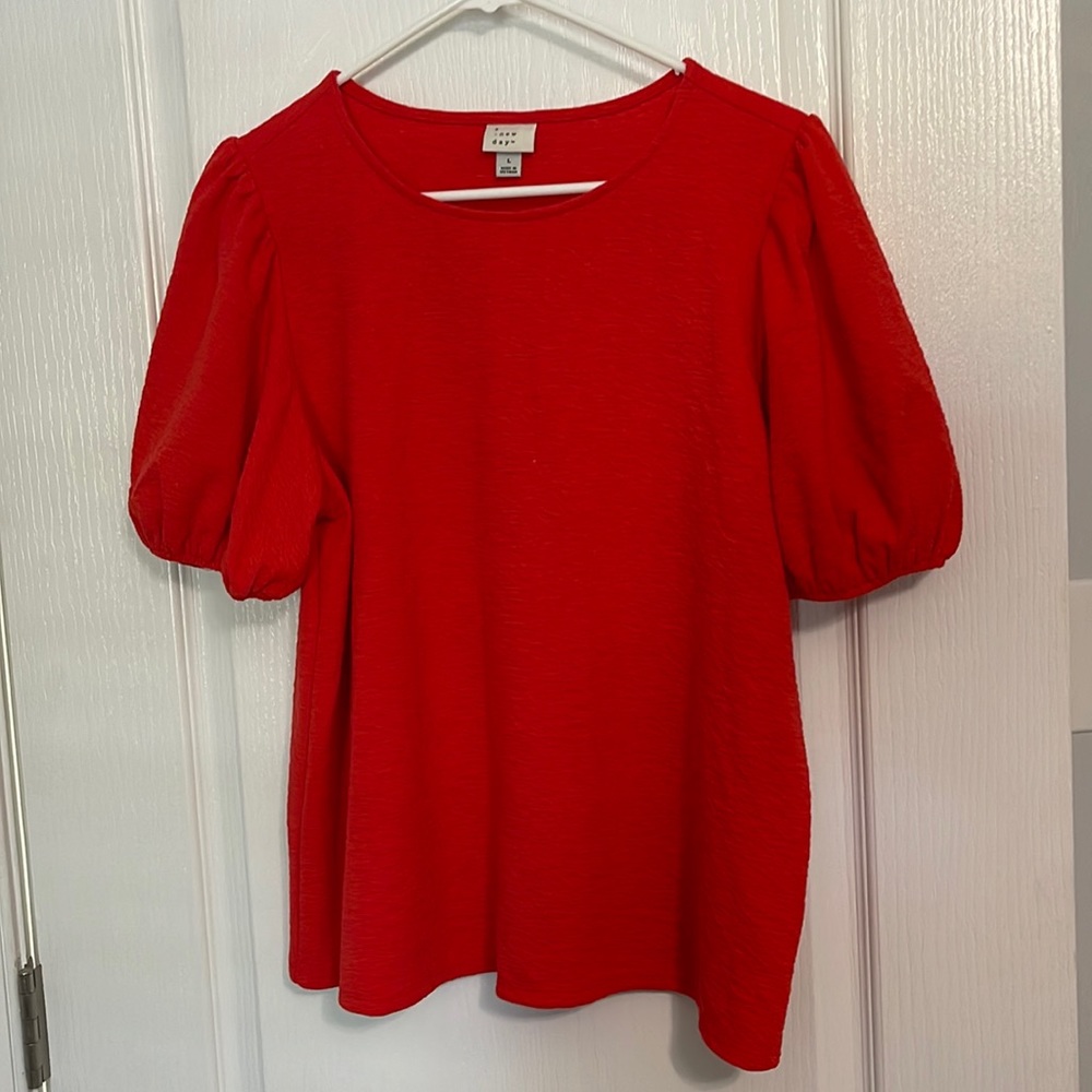 Red-orange blouse